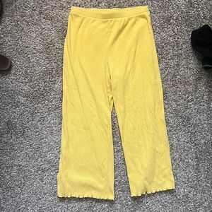 I’ve got yellow, pre loved wild fable capris pants with ribbed fabric.